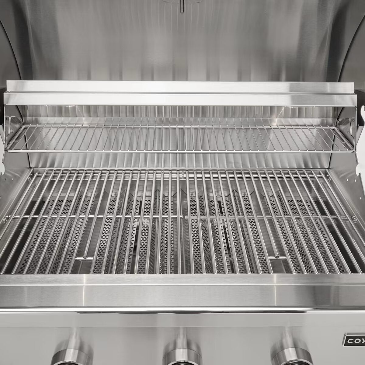 Coyote C Series Gas Grills with lid open showing stainless steel grates and cooking space