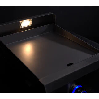 Le Griddle Pro Series 40 Gas Griddle on at night time with lights on