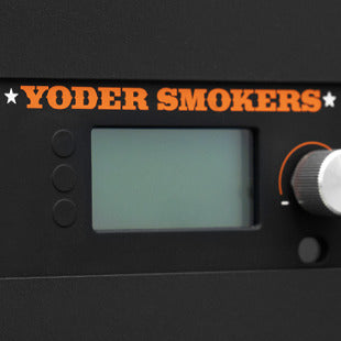 Control panel of a Yoder Smokers product with digital display and control knobs.