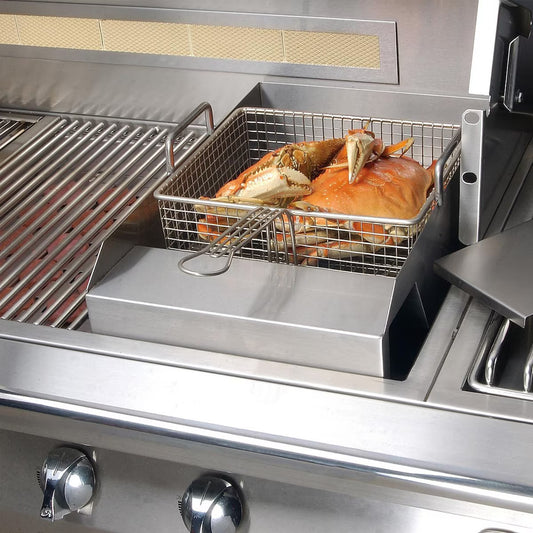 Stainless steel deep fryer basket with food on a grill