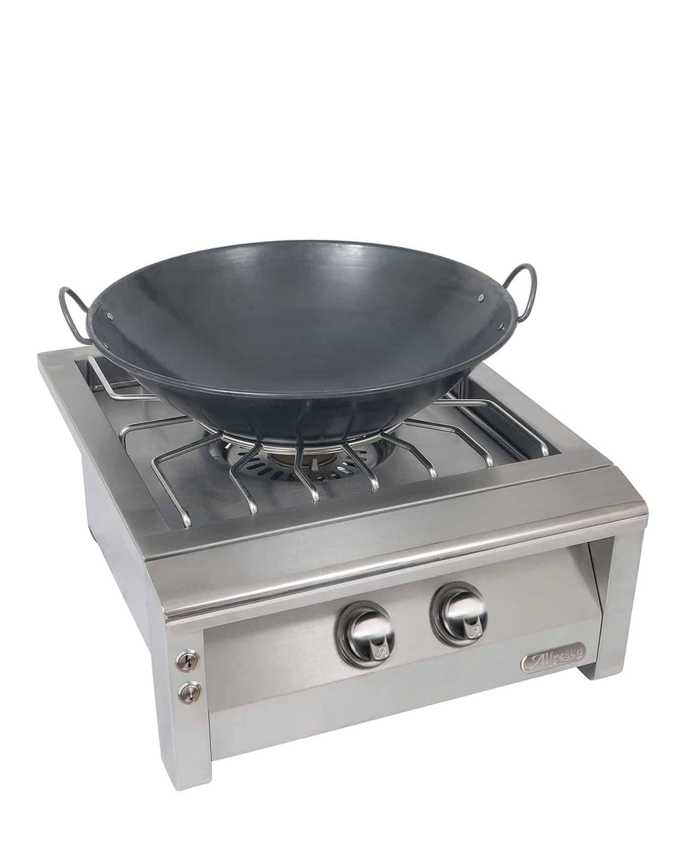 Alfresco Versa Power with a stainless steel front with a wok on the burner on a white background