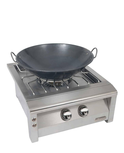 Alfresco Versa Power with a stainless steel front with a wok on the burner on a white background
