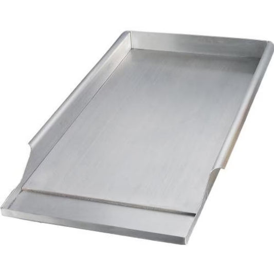 Stainless steel griddle on a white background