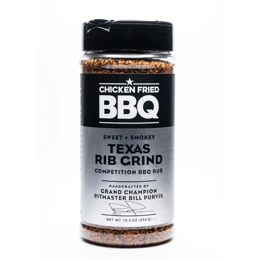 Jar of Texas Rib Grind BBQ rub with black lid on a white background