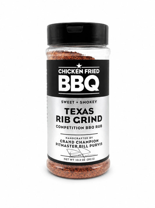 Jar of Texas Rib Grind BBQ rub with a black lid on a white background