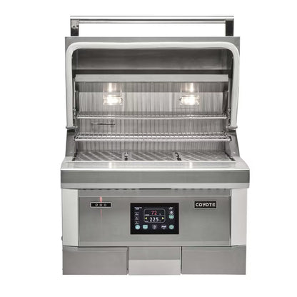Coyote Pellet Grill with lid open on a white background