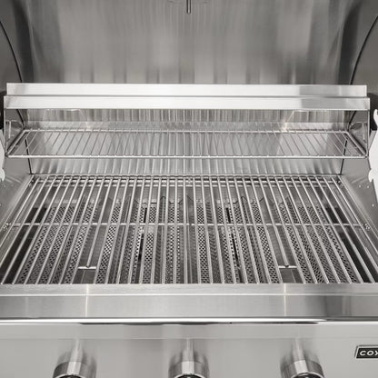 Coyote C Series Gas Grills with lid open showing stainless steel grates and cooking space