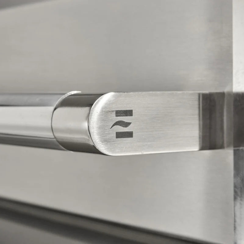 Close up of handle on the Coyote 50-in Built-In Propane Grill / Flat Top Combo on a white background
