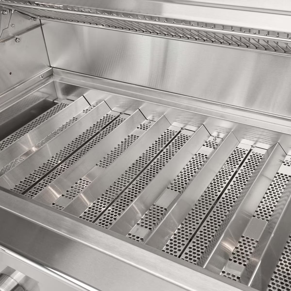 Stainless steel interior of a Coyote CL with perforated grates