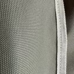 Close-up of a textured gray fabric with a subtle pattern
