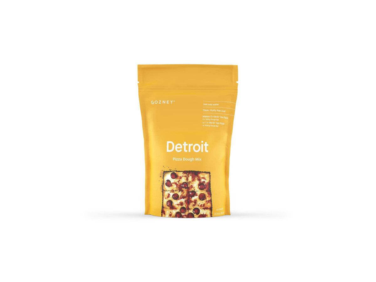 A yellow package of Gozney Detroit Pizza Dough Mix with a transparent window showing the product inside.