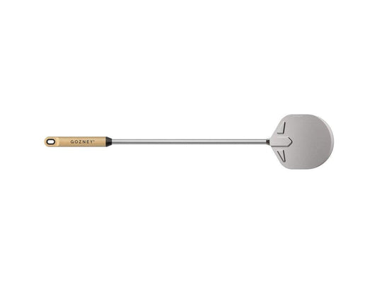 A Gozney Utility Turning Peel with a perforated aluminum blade and a wooden handle.
