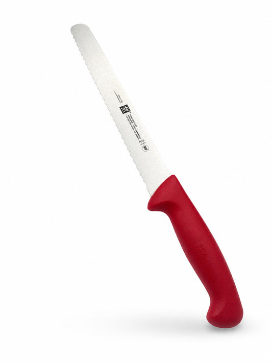 Henckels Twin Master Serrated Slicer with a red handle on a white background