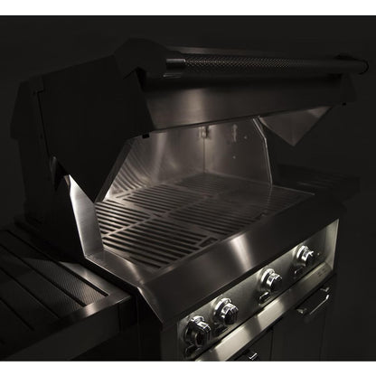 Hestan 36" Built In Gas Grill at nighttime with lights on 