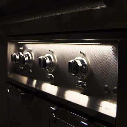 Hestan 36" Built In Gas Grill knobs on at nighttime 