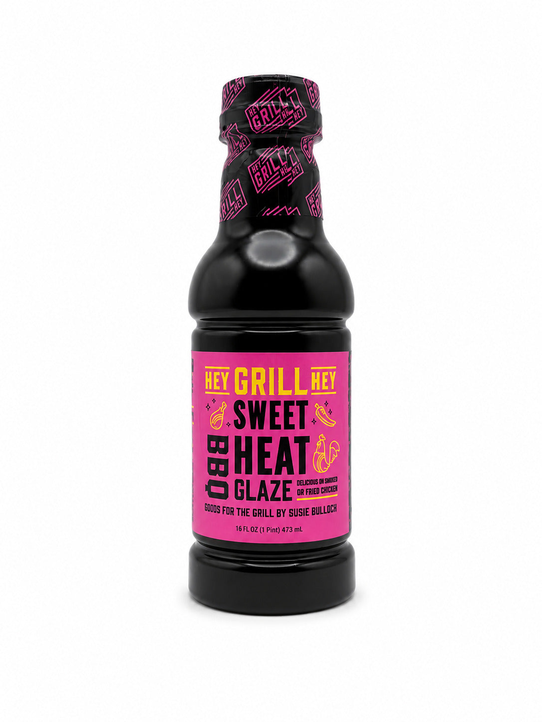 Black bottle of 'Hey Grill, Hey! Sweet Heat BBQ Glaze' with pink label on a white background