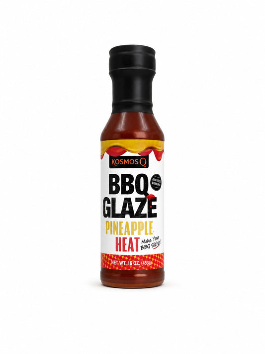 Bottle of Kosmos Q Pineapple Heat BBQ Glaze on a white background