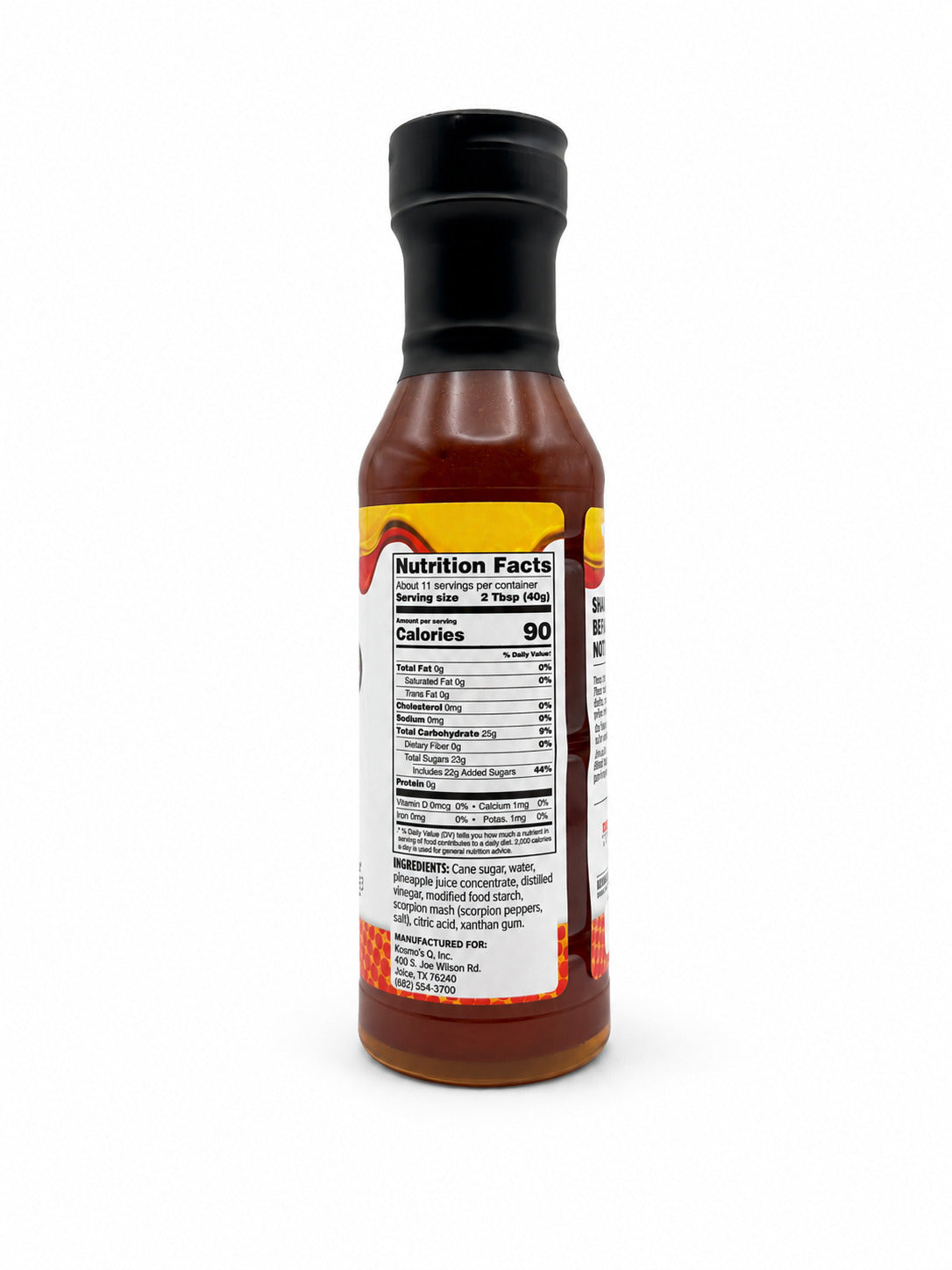 Kosmos Q Pineapple Heat BBQ Glaze bottle with the nutrition and ingredients label on a white background