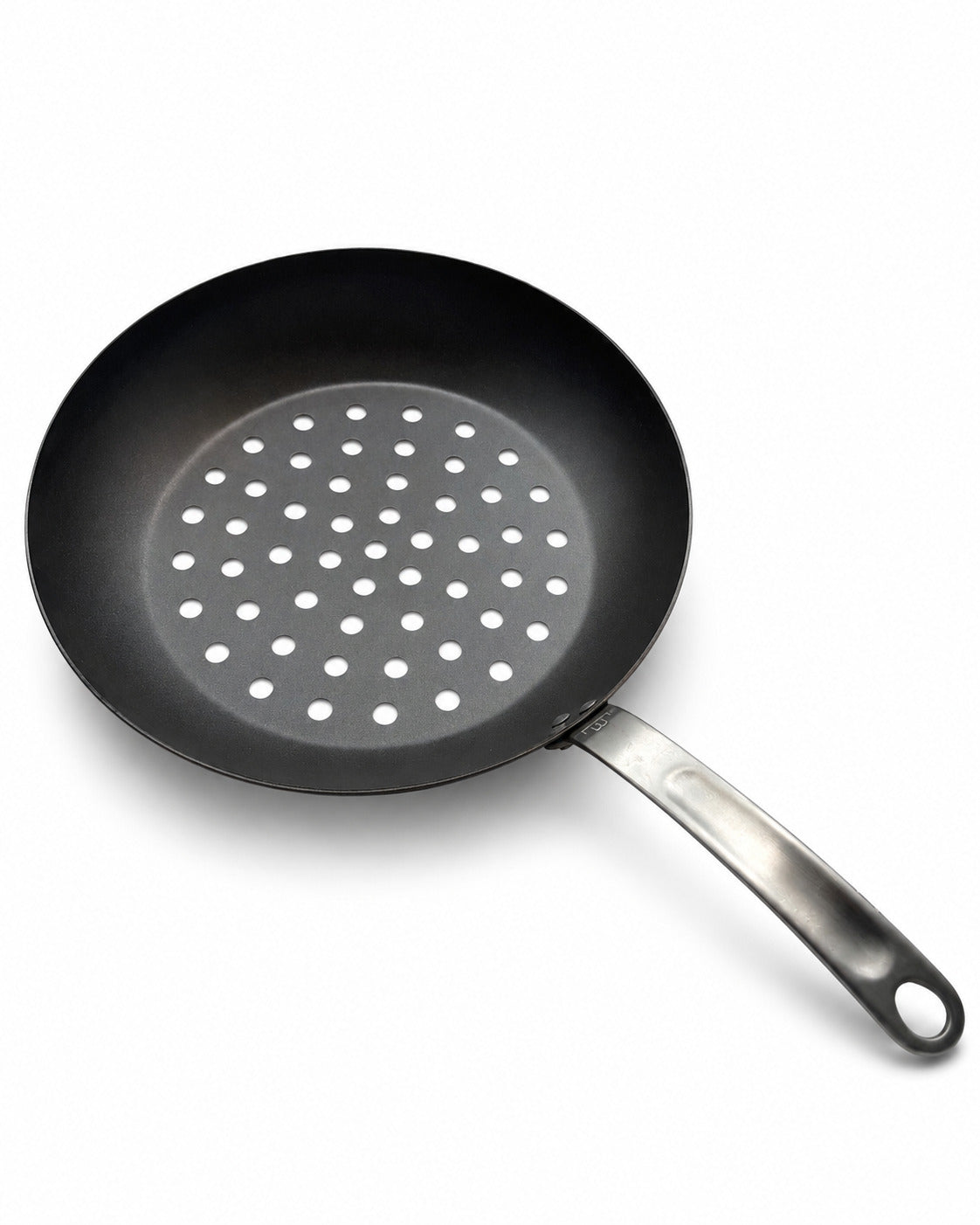 Black frying pan with perforated design on a white background