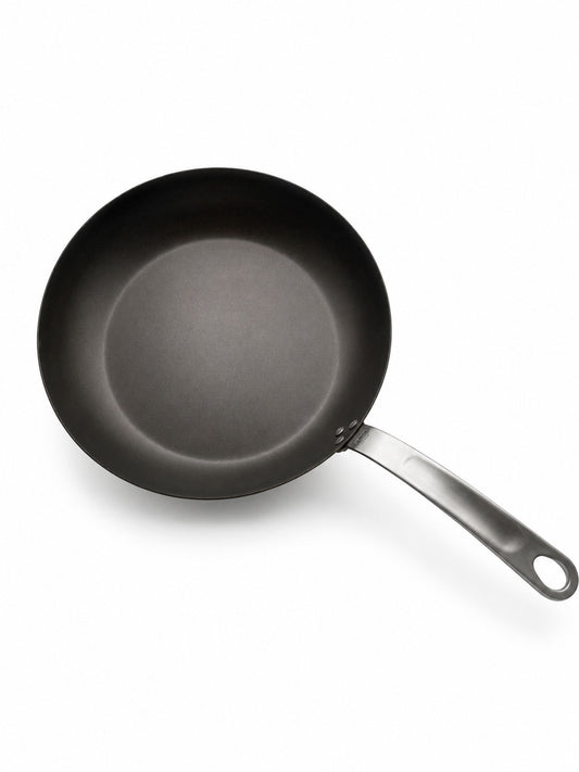 Made In Carbon Steel Frying Pan with a Silver handle on a white background