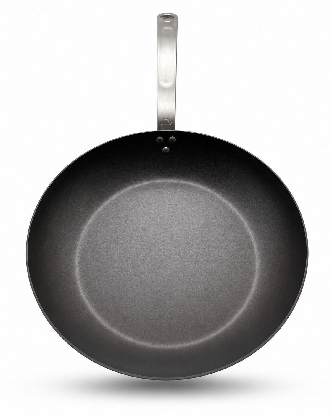 Made In Seasoned Carbon Steel frying pan with a silver handle on a white background