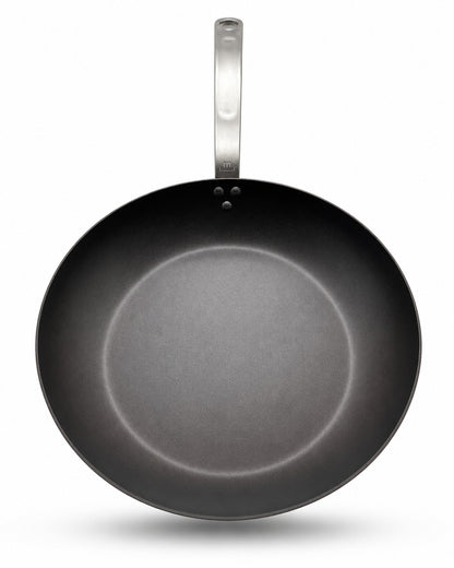 Made In Seasoned Carbon Steel frying pan with a silver handle on a white background