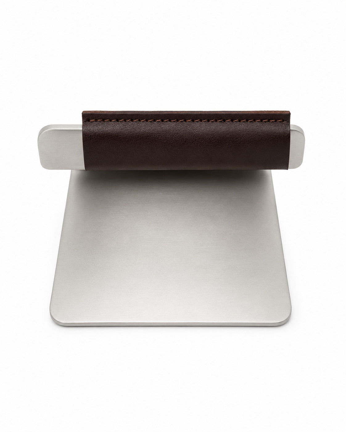 The back of a Made In Grill Press with a brown leather sleeve on a white background