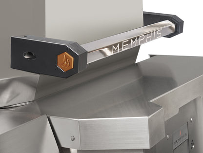 Close-up of a stainless steel and black Memphis grill handle with the brand name MEMPHIS engraved on the metal bar and a small orange flame emblem.