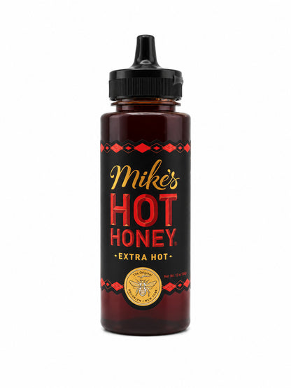Bottle of Mike's Extra Hot Honey on a white background