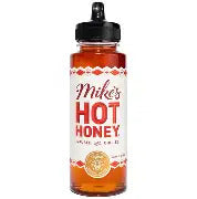 Bottle of Mike's Hot Honey with a black cap on a white background