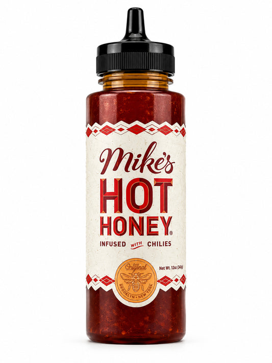 Bottle of Mike's Hot Honey with a white label on a white background