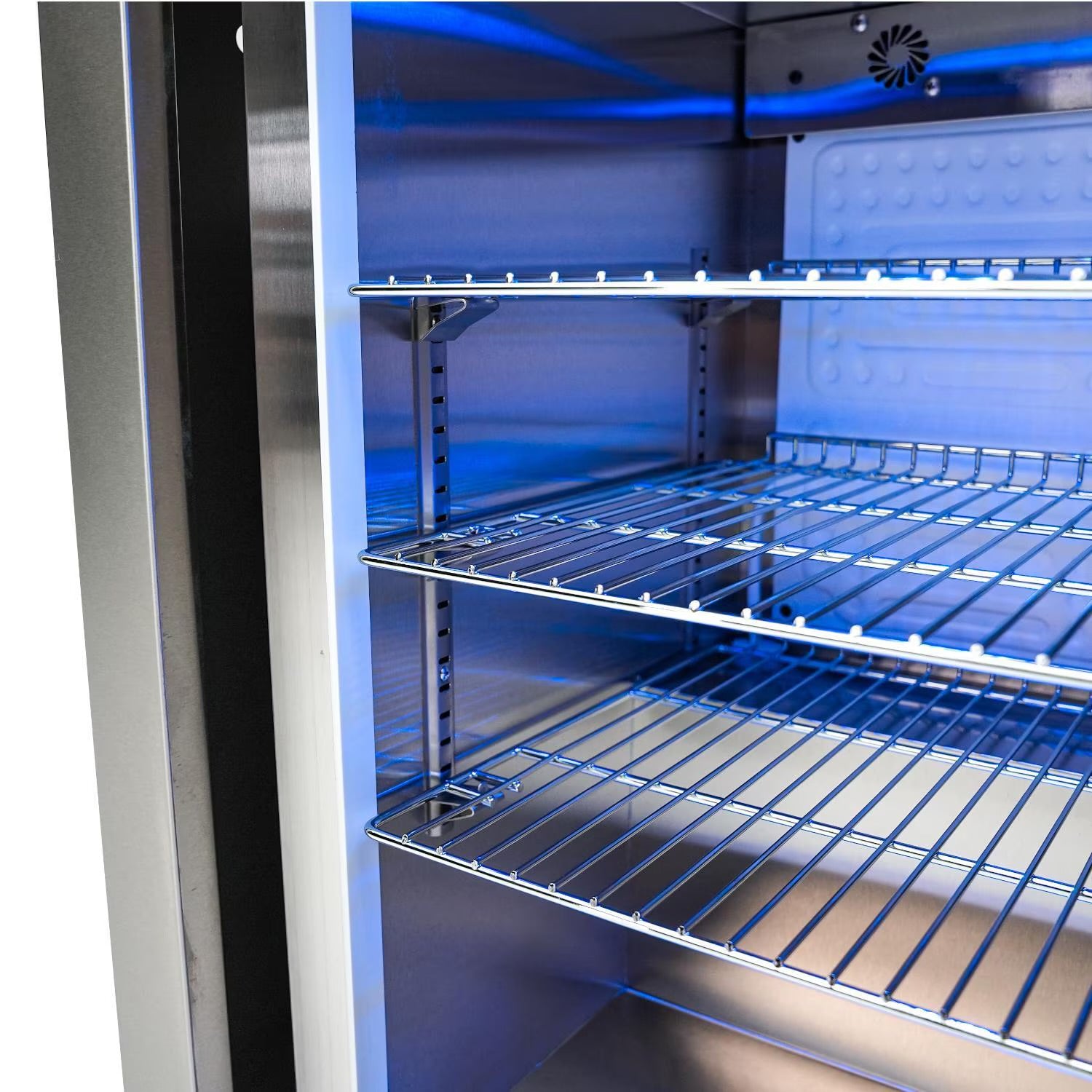 Mont Alpi Refrigerator interior with metal shelves and blue lighting