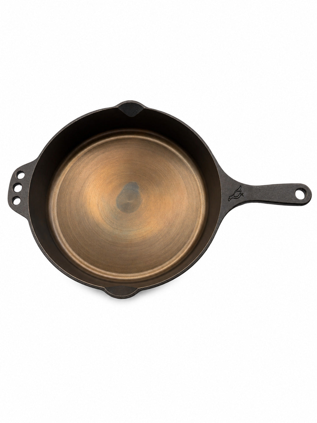 Smithey Ironware 10" Cast iron skillet with a smooth interior on a white background