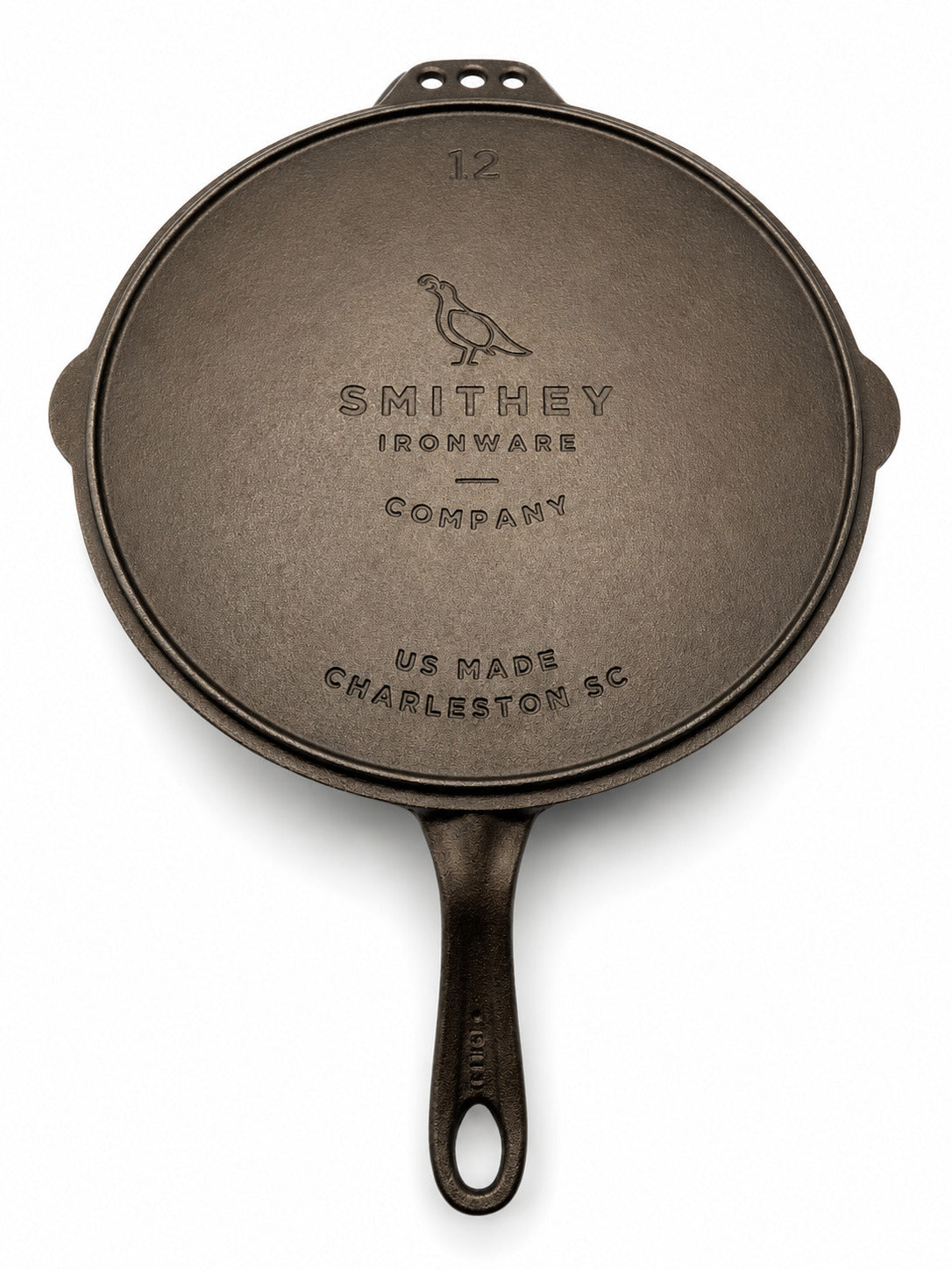 Smithey Ironware 12" Cast iron flat top Griddle bottom with 'Smithey Ironware Company' branding on a white background