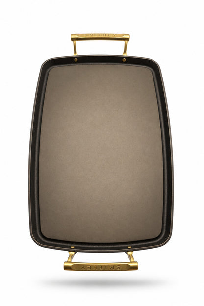 Smithey Ironware Double Burner Griddle with gold handles on a white background