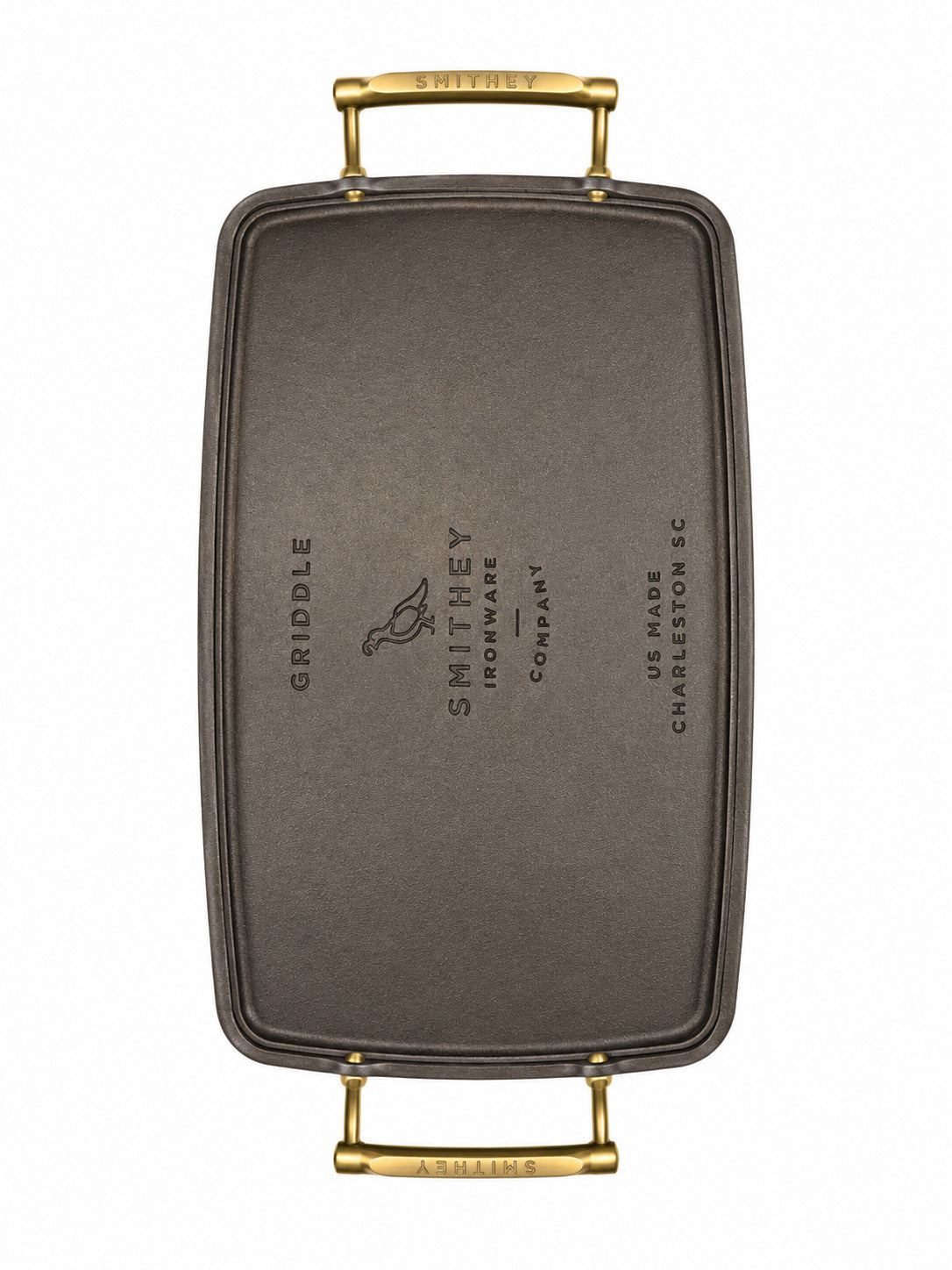 Smithey Ironware Double Burner Griddle bottom with gold handles on a white background