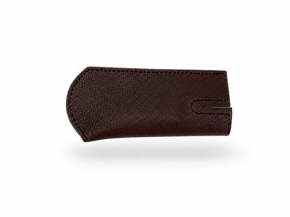 Bottom of a Smithey Ironware Brown Leather Skillet Sleeve on a white background
