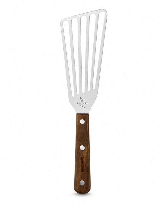 Smithey Ironware Slotted Spatula with wooden handle and metal head on a white background