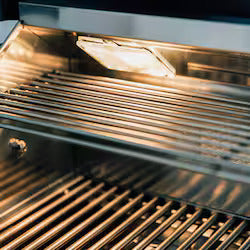 Close-up of a grill with glowing heating element