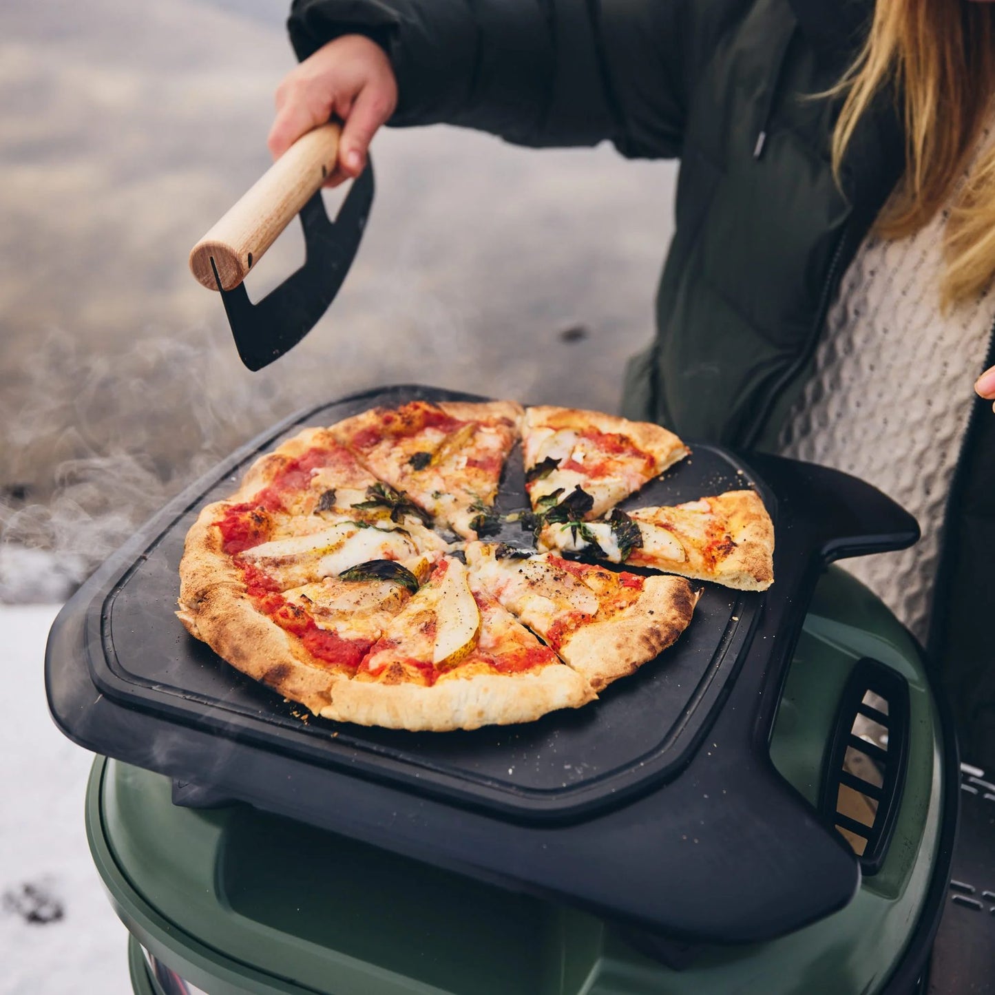 Gozney Tread Roof Rack with a pizza on top of the roof rack