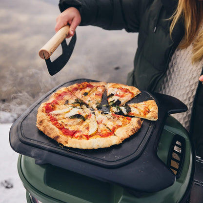 Gozney Tread Roof Rack with a pizza on top of the roof rack
