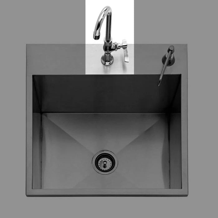 Stainless steel kitchen sink with faucet on a gray background