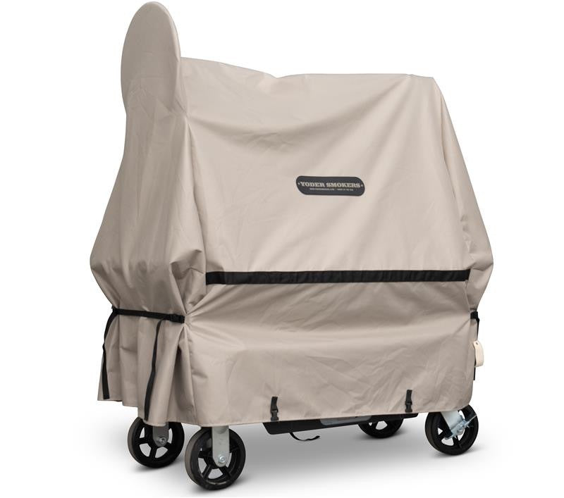 Beige grill cover with black trim on a white background
