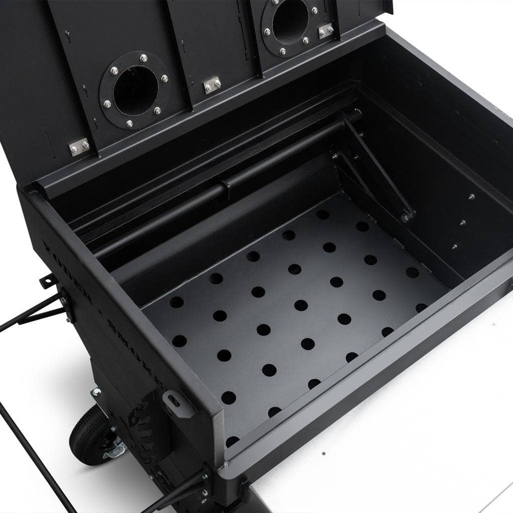 Close up Yoder Smokers Charcoal Flat Top Grill adjustable charcoal basket on a white background