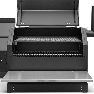 Black grill with open lid on a white background