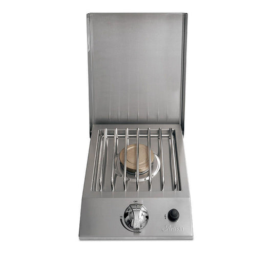 Artisan built-in single side burner with a brass burner and stainless steel construction, featuring a closed lid and a visible ignition control knob on the front.